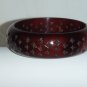 Brown resin bangle with 4-pointed star perforations