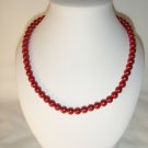 String of red faux pearls