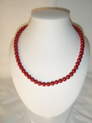 String of red faux pearls
