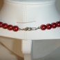 String of red faux pearls