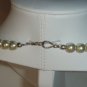 String of white faux pearls
