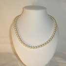 String of white faux pearls