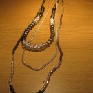 Black wood bead and silver tone metal bead tri-strand necklace (£10.00)