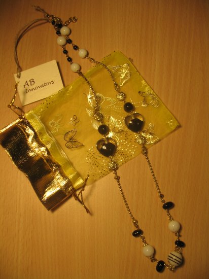 Black, white and gold glass, ceramic and metal bead necklace (£11.00)