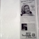 1948 Sealright Milk Bottle Hoods ad featuring Veronica Lake