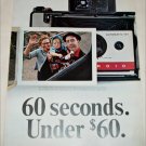 1965 Polaroid Land Automatic 104 Camera Couple ad
