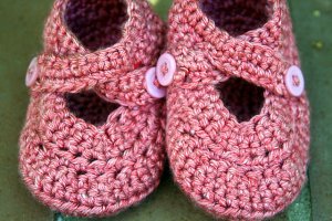Sweet strawberry booties size 6-9 months