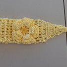 YELLOW CROCHET HEADBAND WITH SAME COLOR FLOWER ATTACHED