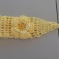 YELLOW CROCHET HEADBAND WITH SAME COLOR FLOWER ATTACHED