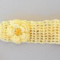 YELLOW CROCHET HEADBAND WITH SAME COLOR FLOWER ATTACHED