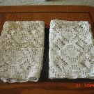 A pair of crochet place mat