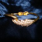 $9.99 Feather shape bracelet-adjustable size gold tone and crystal zirconia  bugget & round