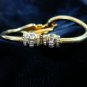 $9.99 Feather shape bracelet-adjustable size gold tone and crystal zirconia  bugget & round