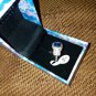 NIB PIERMONT JEWELS-RING SIZE 9. BLUE GEM silver color sorounded diamond like