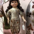 Pheasant Feather dressed porcelain doll