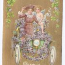 Vintage Valentine Postcard Cupid Cherub Car Lady Gold Moire Background Shamrocks Automobile