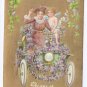 Vintage Valentine Postcard Cupid Cherub Car Lady Gold Moire Background Shamrocks Automobile