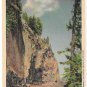 WY Yellowstone National Park WY Overhanging Cliff Near Tower Fall Vintage Haynes Linen Postcard