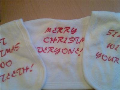SET OF THREE BABIES BIBS WITH CHRISTMAS SLOGANS/LOGO'S NEW
