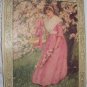 1909 Lovely Victorian Lady in Pink Under Flowered Tree Antique Print