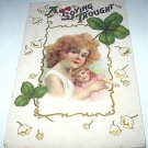 St. Patricks Day Green Shamrocks Antique Postcard-Red-haired Girl holding Dolly