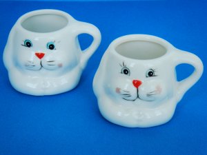 Two Small Ceramic Bunny Face Decorative Cups