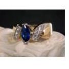 14KT gold HGE sapphire simulatedbypass ring, size 7 (fr-5)