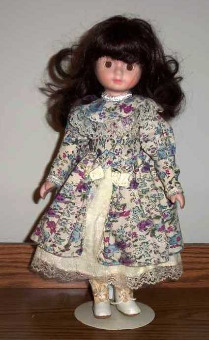 Porcelain Girl Doll Wearing White Lace Dress With Purple And Blue Flowers