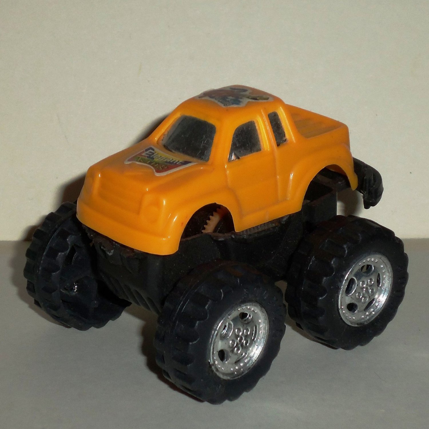 Orange Pull Back Plastic Monster Truck Loose Used