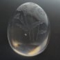 Glass egg paperweight with copper wheel engraved flowers