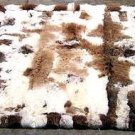 White and brown baby alpaca fur rug with very strong spots, 80 x 60 cm