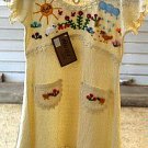 White baby dress from Ñusta, ekological pima cotton
