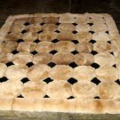 Light brown alpaca fur carpet with black rhombus designs, 80 x 60 cm