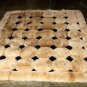 Light brown alpaca fur carpet with black rhombus designs, 190 x 140 cm