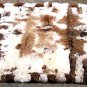 White and brown baby alpaca fur rug with very strong spots, 150 x 110 cm