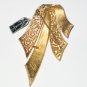 Trifari Gold Tone Solid and Filigree Ribbon Brooch BRO2071