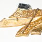 Trifari Gold Tone Solid and Filigree Ribbon Brooch BRO2071