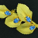 Classy Gold Tone Leaf and Blue Rhinestone Brooch Bro2166