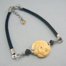 Round Carved Bone Cat Bracelet on Cord