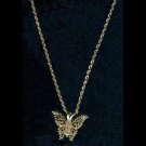 Gold-tone butterfly pendant with diamond-like stones