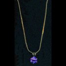 Gold-tone pendant with amethyst-like stone
