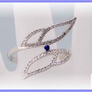 Modern Art.  Diamond and sapphire wings.  Right hand ring Sz 8.5