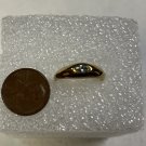 JEWELRY RING MENS AVON GOLD TONE WITH CENTER CLEAR STONE 1/4" X 1/8"