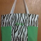 Brown zebra and green boy diaper bag