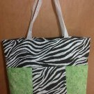 Black and white zebra with lime green diaper bag