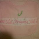 Ribbon bib with monogram