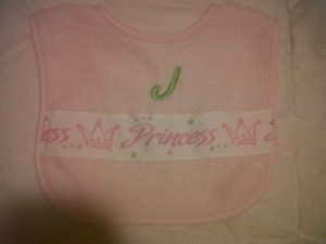 Ribbon bib with monogram