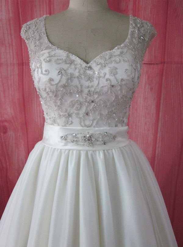 Plus size cap sleeve brideal dress from Darius Cordell