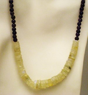 NK009       Moonstone Necklace with a Garnet Strand. Sterling Silver Clasp.