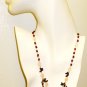 NK019       Multistone Necklace with a Garnet and Rose Quartz Strand. Sterling Silver
